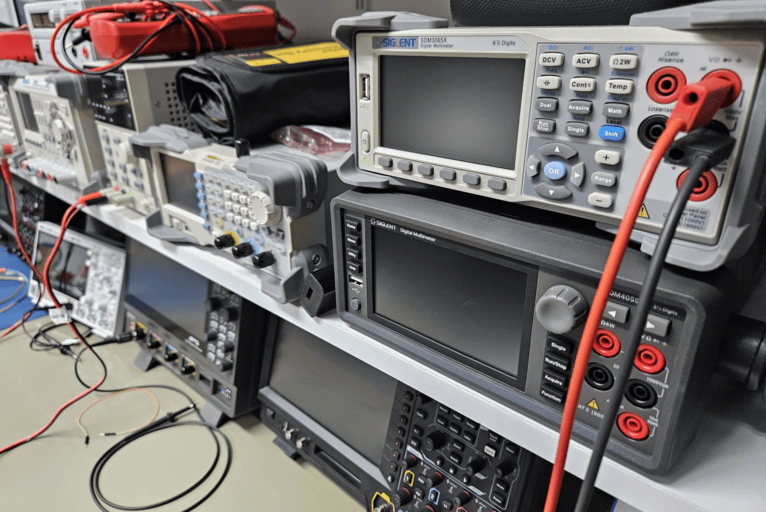 Electronics laboratory with oscilloscopes and measurement equipment